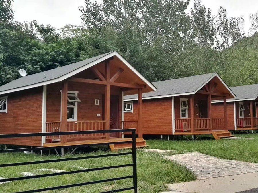 Trio of Small Wooden Houses Offer Serene Escape in Scenic Retreat