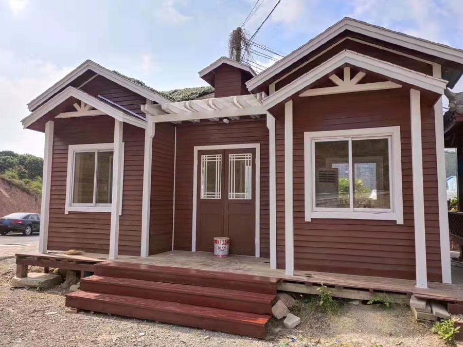 Rustic Red Small Wooden House Offers Immersive Nature Retreat