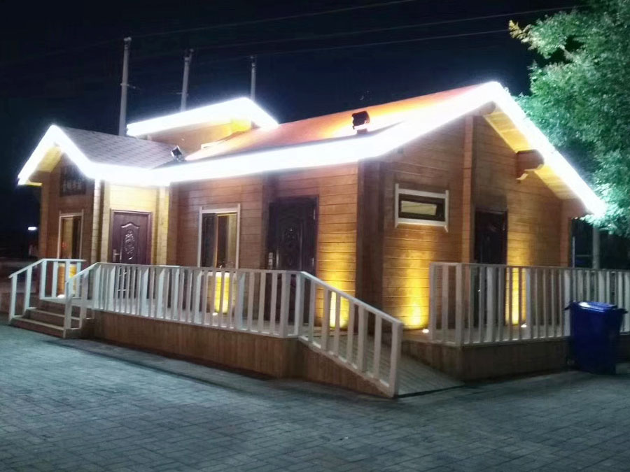 Cozy Small Wooden House Illuminates Nighttime Escapes in Scenic Area