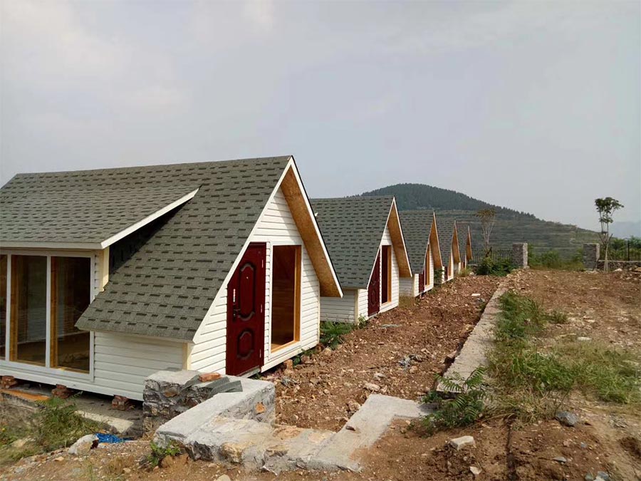 Mountain-Top Small Wooden Houses Offer Serene Escape in Scenic Area