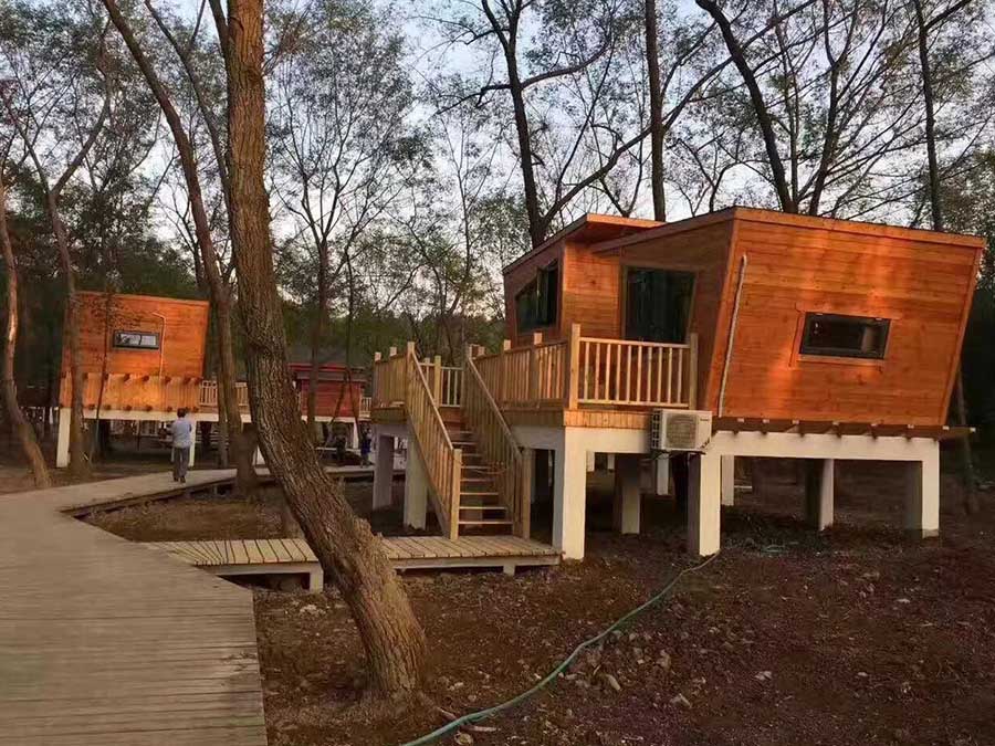 Uniquely Designed Small Wooden House Enhances Scenic Experience